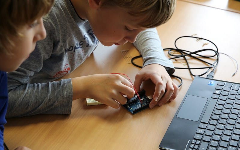Child exploring electronics and circuits